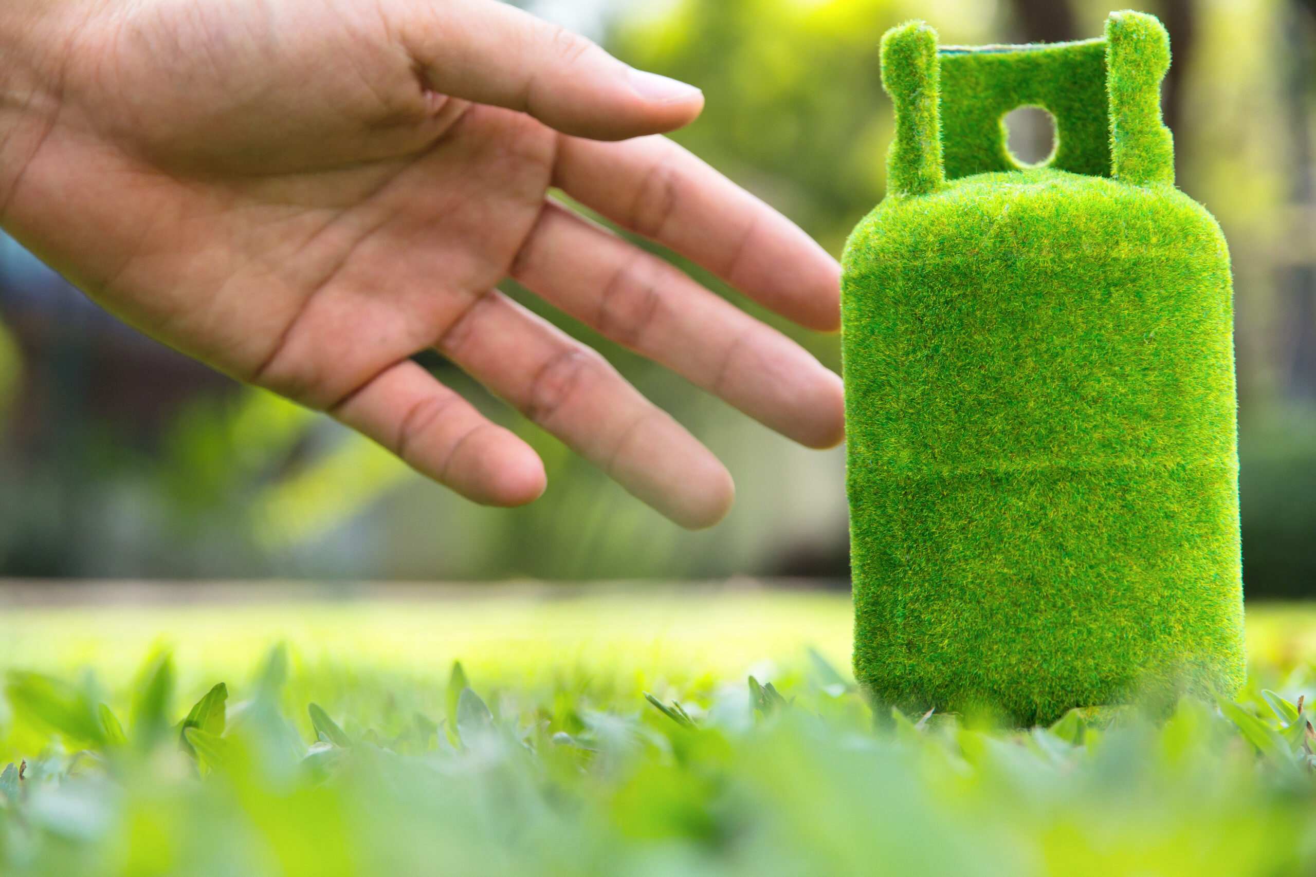 Hero image of man touching Green LPG bottle